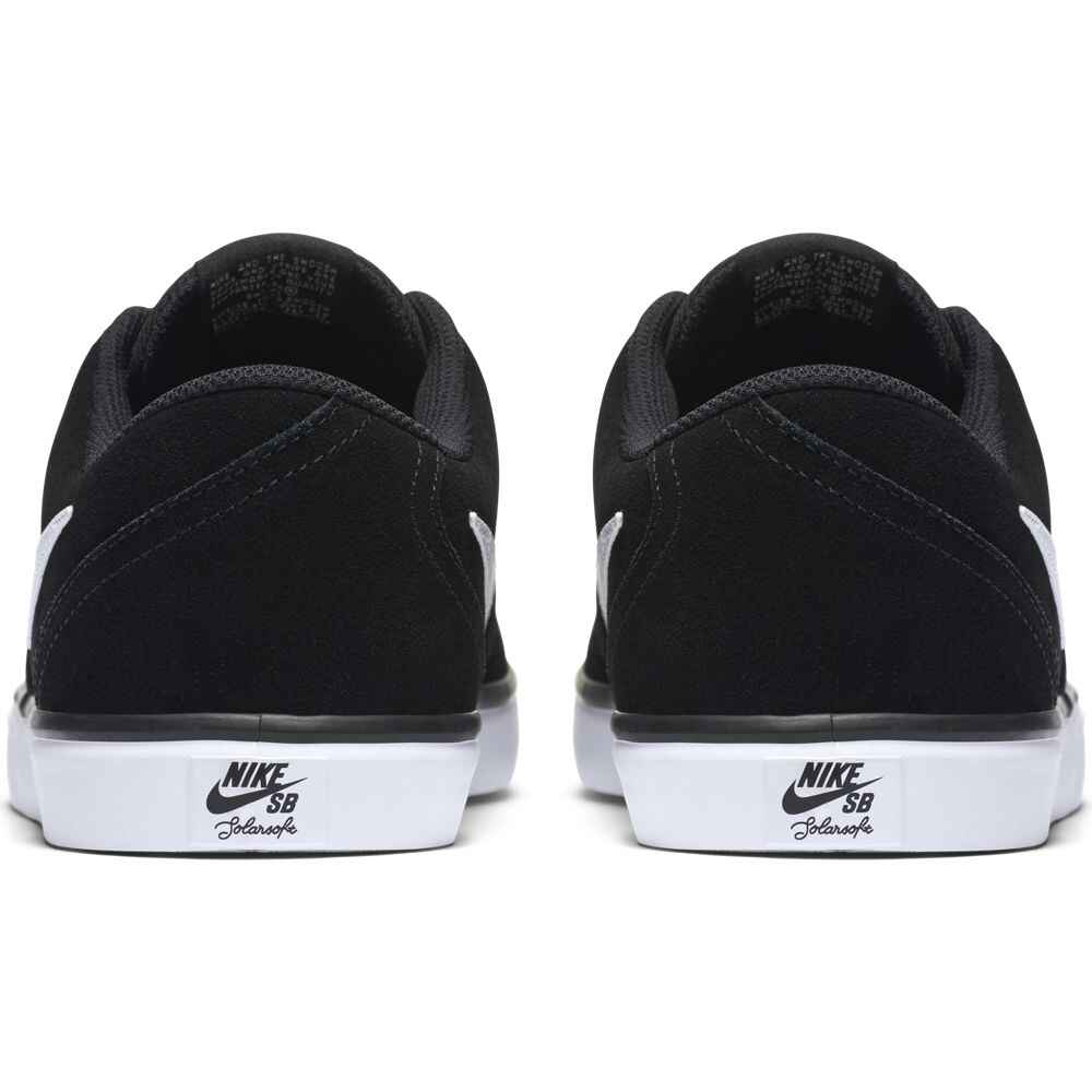 white nike shoes with black check